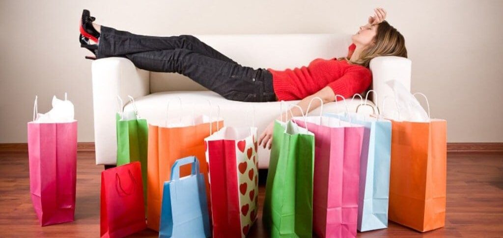 Shoppers-Briefer- About Featured.Image-woman-on-sofa-with-shopping-bags-bing-free-stock-images-shopping-addiction-2794442793.jpg